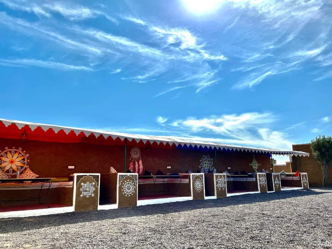 Explore Overnight Desert Camp Jaisalmer outdoor lounge with canopy awning and floor cushions for high tea — real property photograph